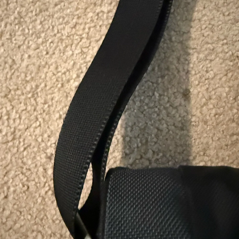 Tumi Black Laptop Messenger Bag with Subtle Red Accents